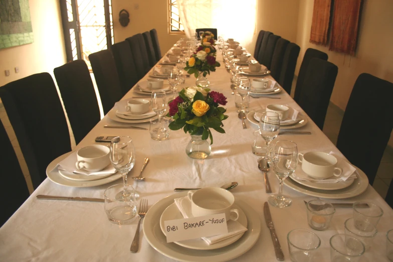 a table set with dinnerware for four
