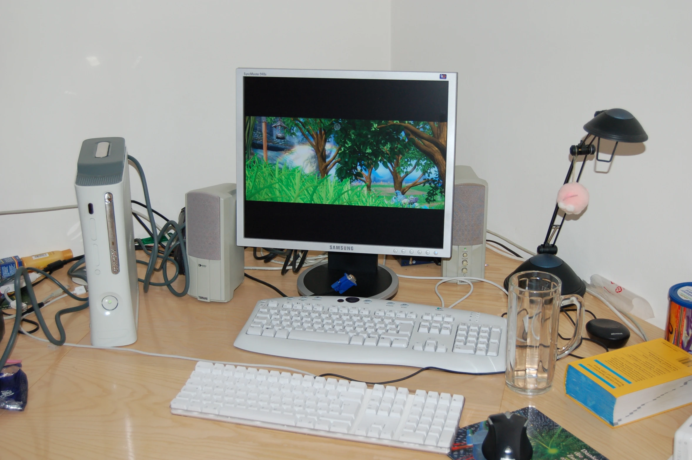 a desktop computer sitting on top of a wooden desk