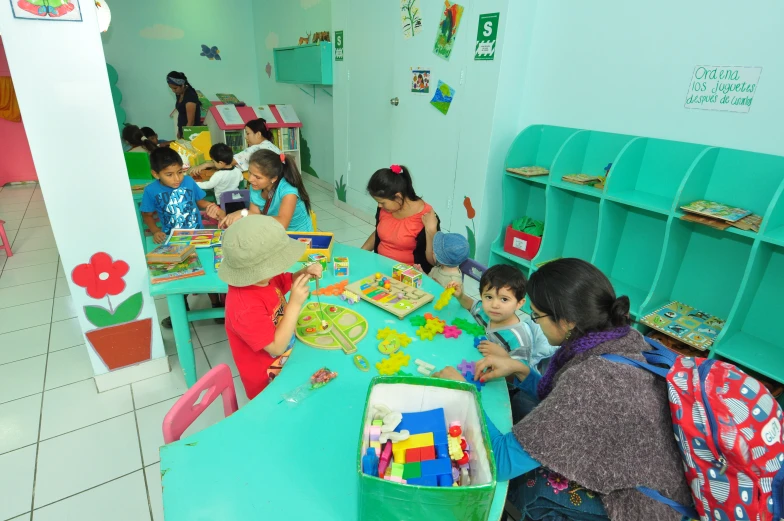 children play with colorful toys at a table