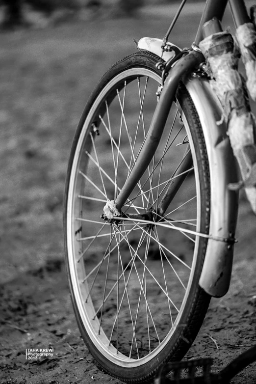 the wheels and spokes of an old bicycle