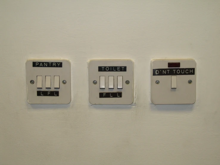 a close up of two electrical ons on a wall