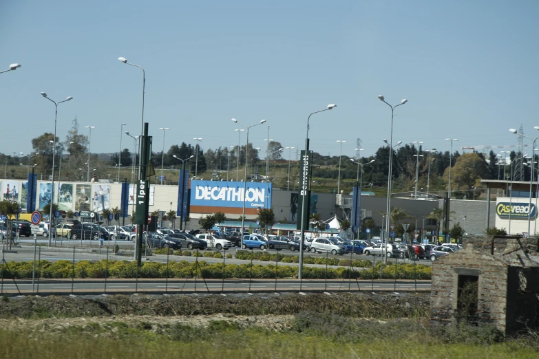 traffic moves down the busy highway near a local business