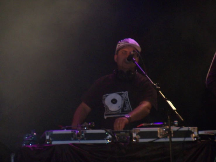 a man with a beard and glasses on playing keyboards