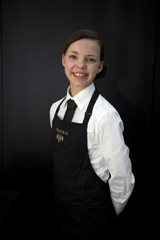 a woman that is wearing a tie and holding a knife