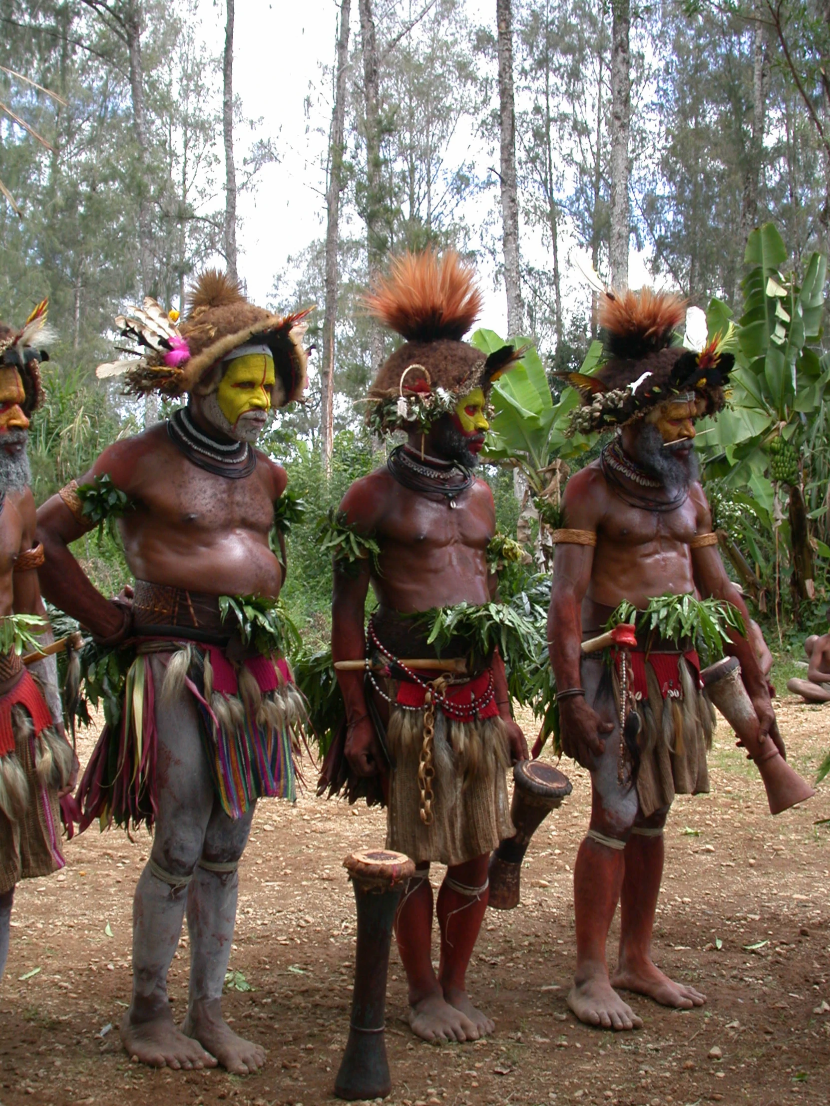 some people dressed in tribal style with different colors