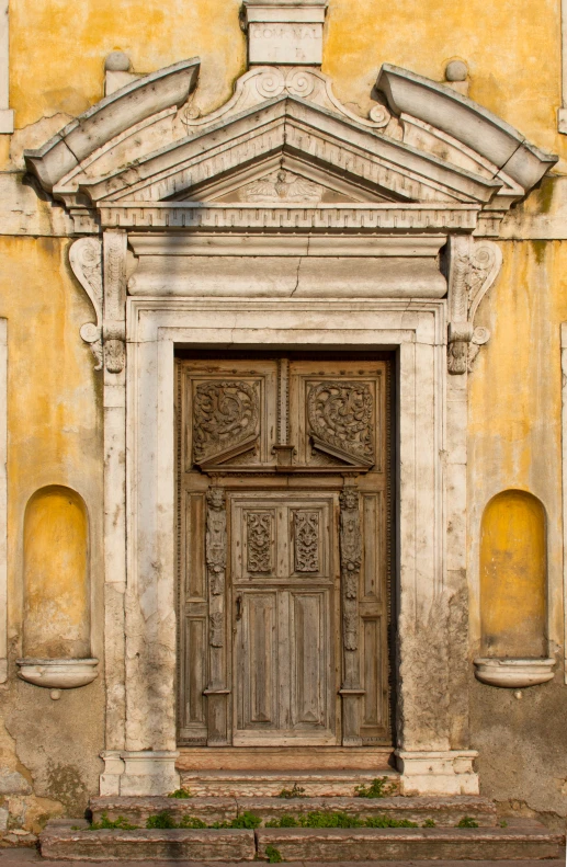 a large wooden door in front of a stone building