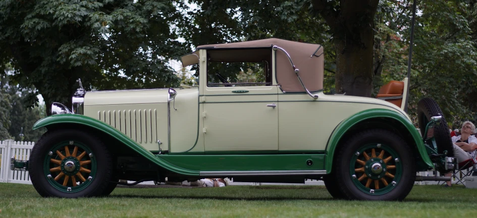 the classic model is parked in a field