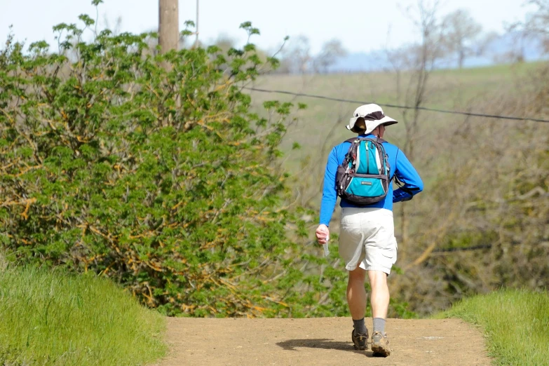 a person with a back pack on a trail