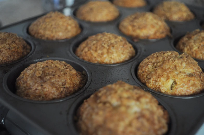 a close up image of some muffins in a black pan