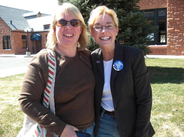 two woman standing next to each other