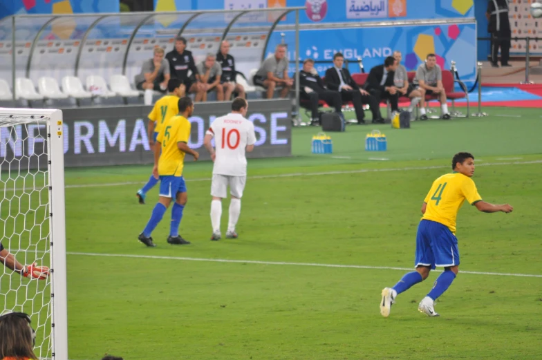 the men are playing soccer on a field