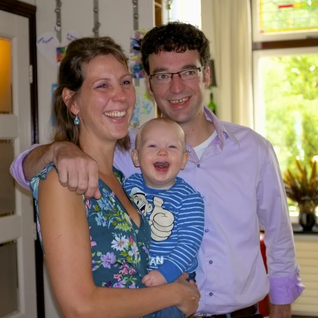 a man, woman and boy pose for a picture together