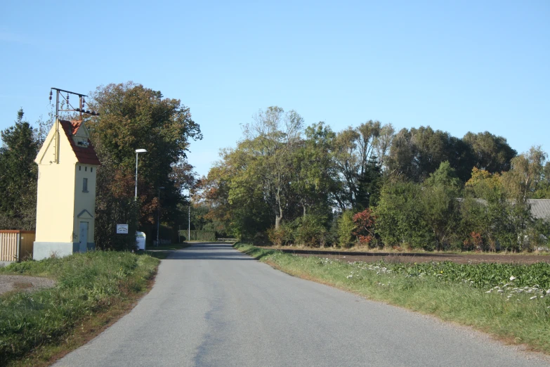 there is a tower that is at the end of a road