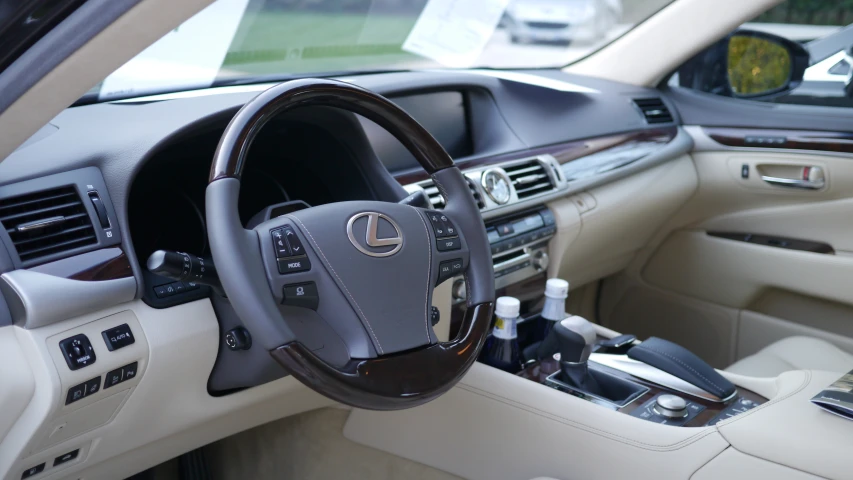 a steering wheel and dashboard s from inside a car