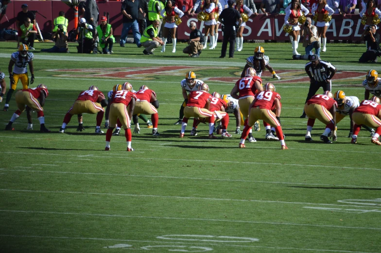 a football game with many players in the middle