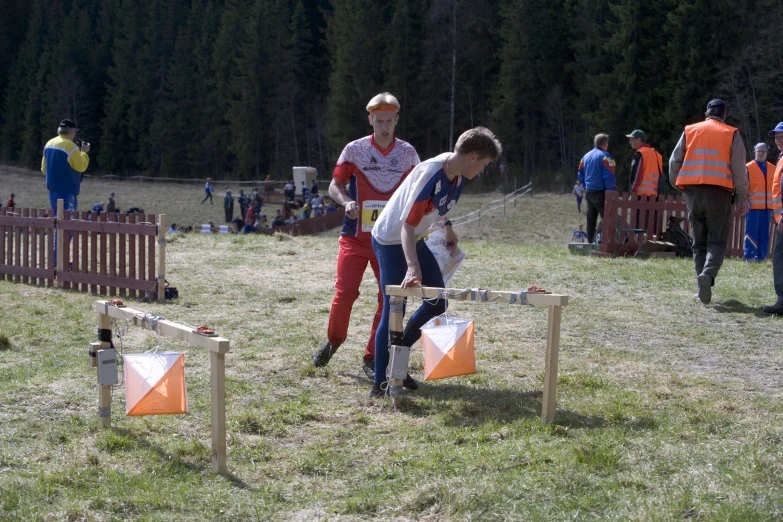 two men at the cross country event in their uniform