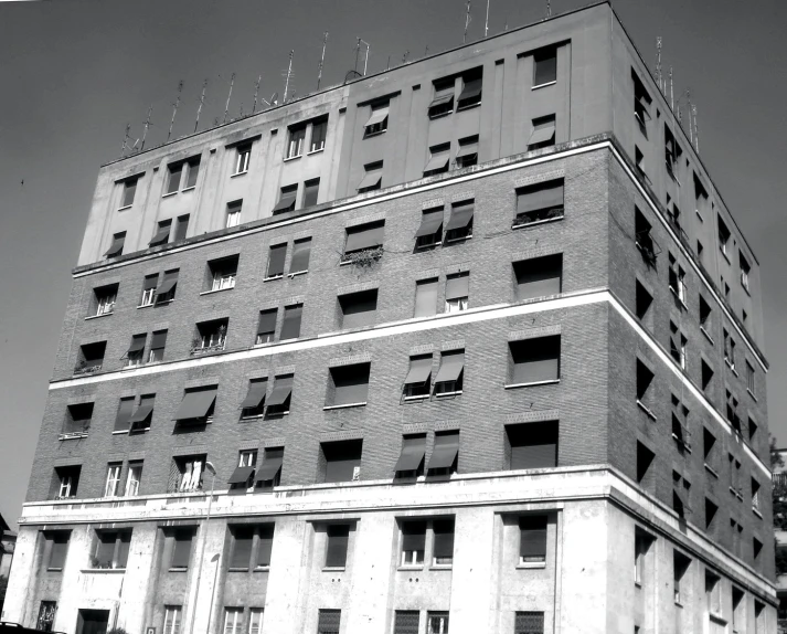 the facade of an apartment building with windows and balconies on top of the two story building