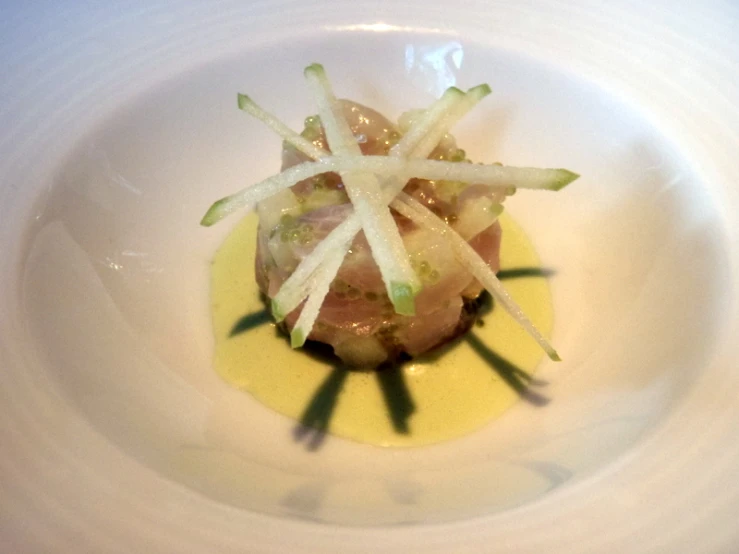 a plate with food, including some type of vegetables