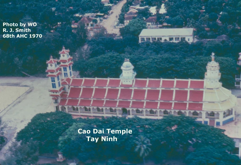 this aerial image shows an old building with a red roof