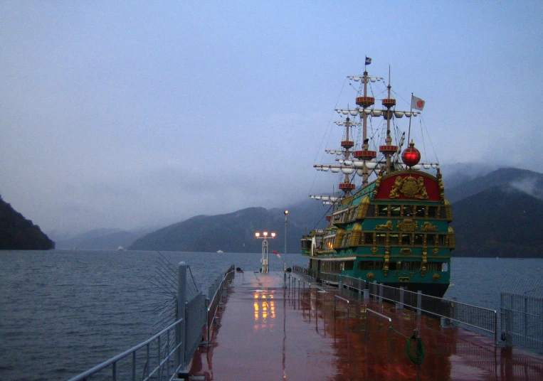 a boat in the middle of a pier on a wet day