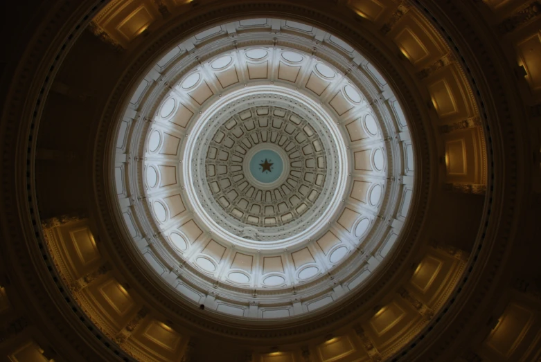 view looking up through the ceiling at a dome shaped building