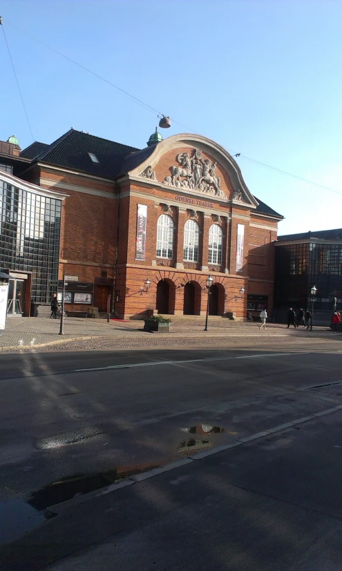 a very old building on a city street corner