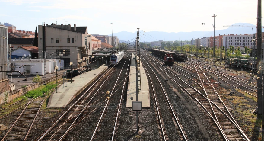 several trains are parked in a train yard