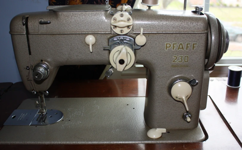an old sewing machine with a cute face on it