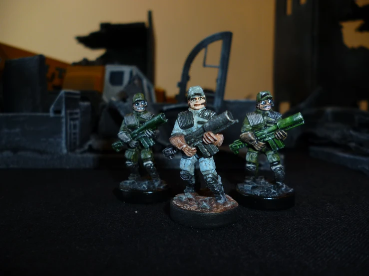 a number of toy soldiers with a rifle