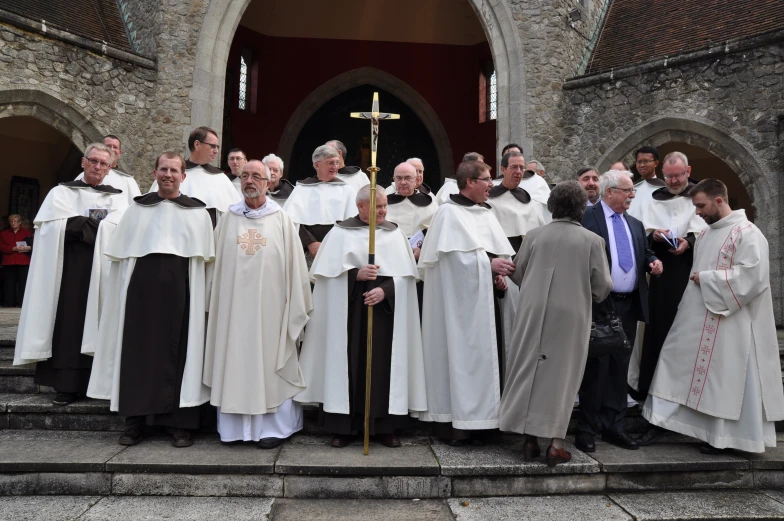 a large group of men standing around each other