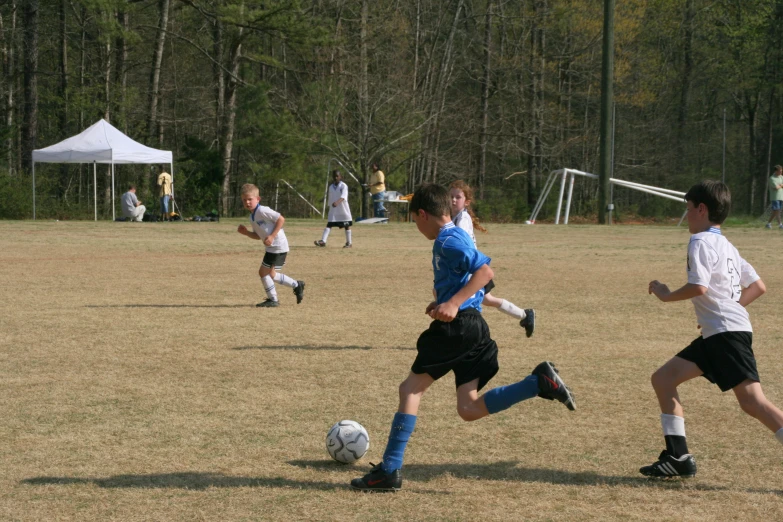 a group of young men playing a game of soccer