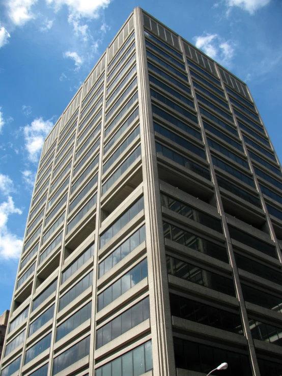 an image of a very tall building with a blue sky in the background