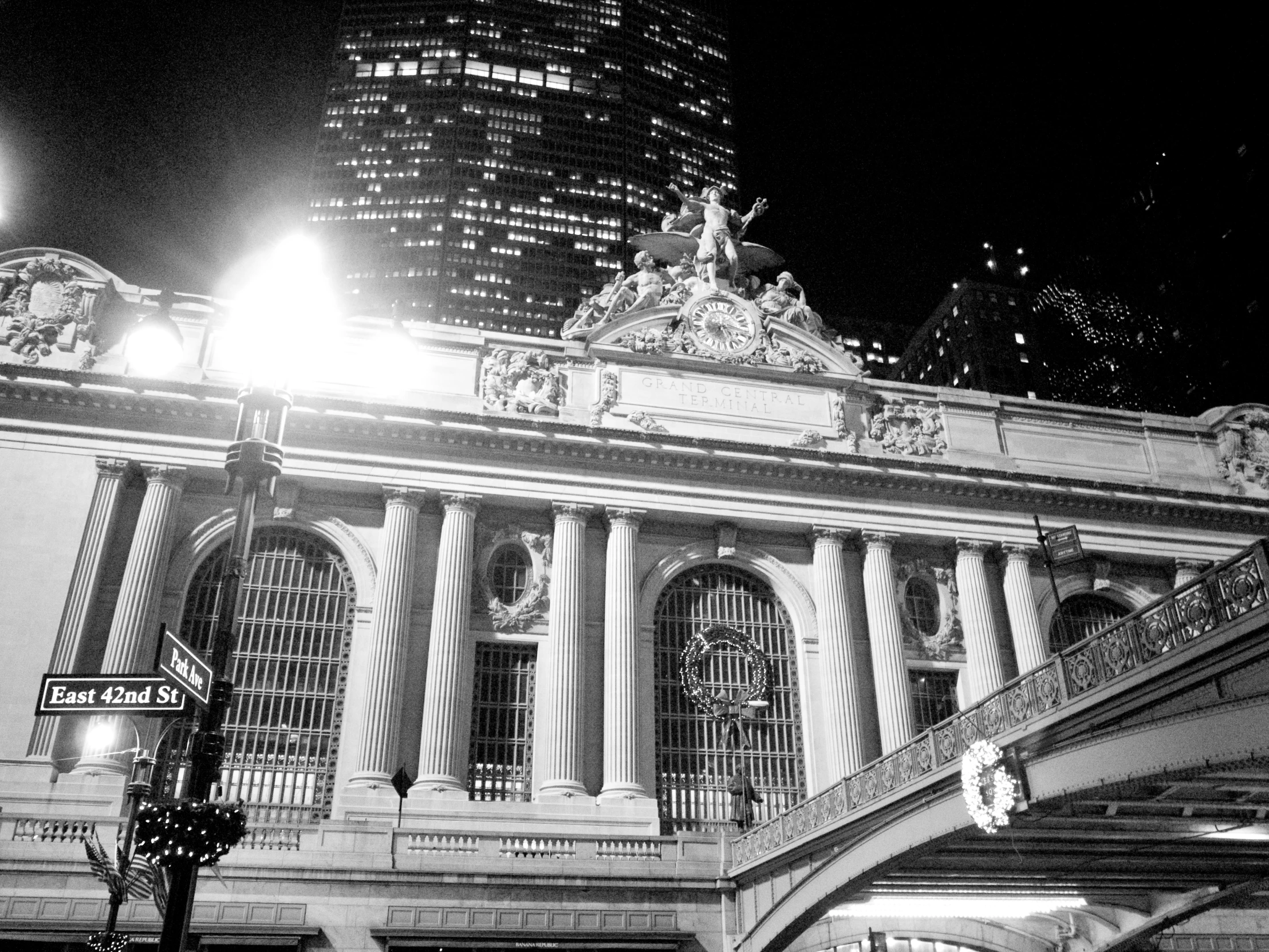 a very old building in a big city at night