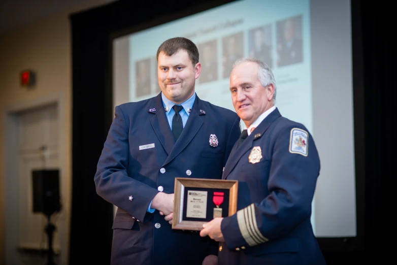 the air force captain is presented with his award