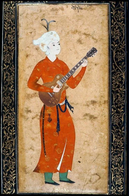 an asian man playing a guitar
