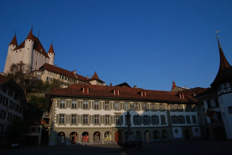 a building with large towers sitting in front of it