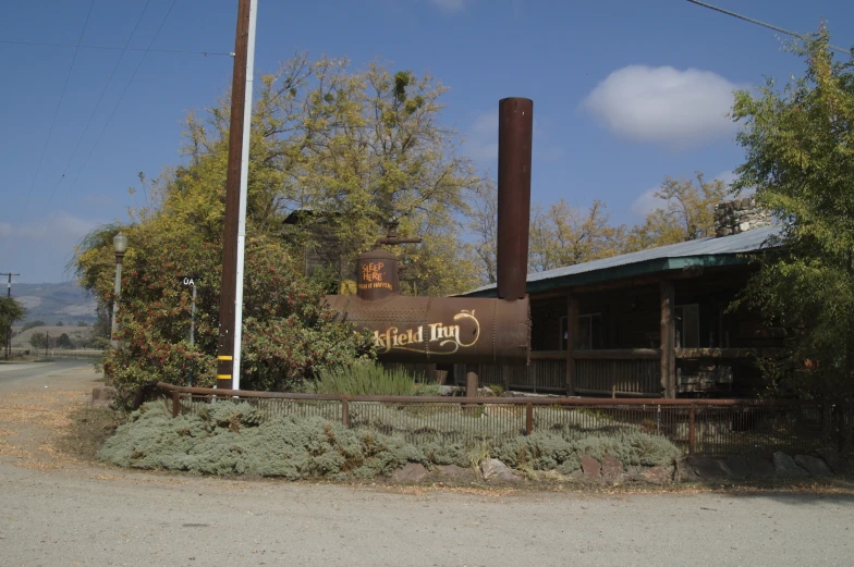 a rusted out building near a wooden street