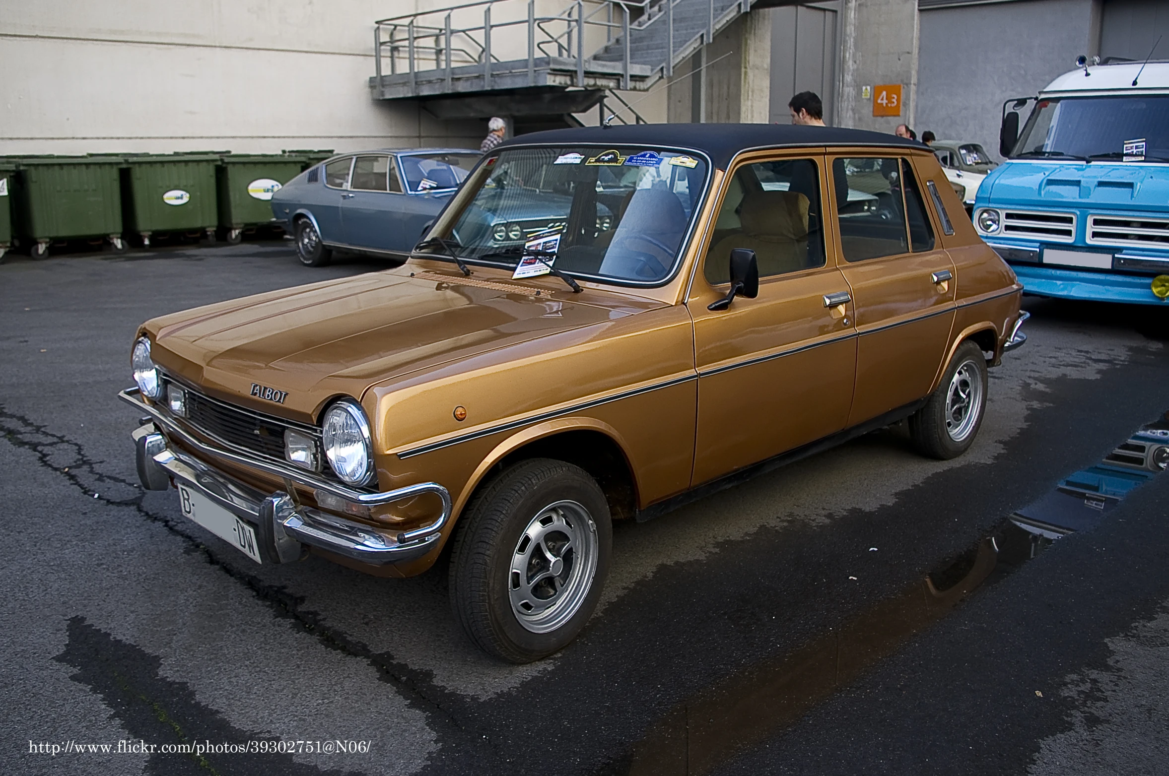 an old car parked near other older cars