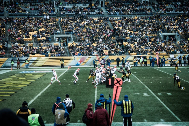 football players in action on the field during a game