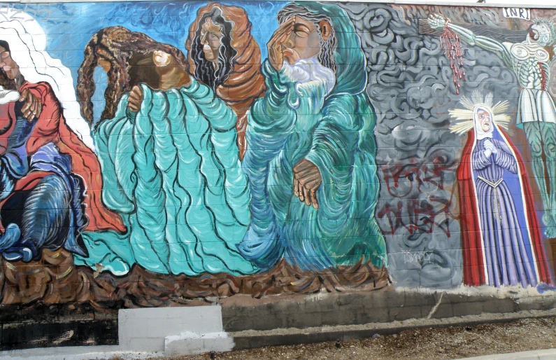 a mural on the side of a wall of three women and two men holding their hands in prayer