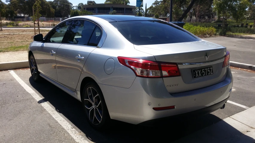 a silver car parked on the side of the street