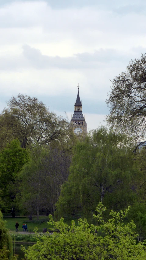 large tower towering over city of trees