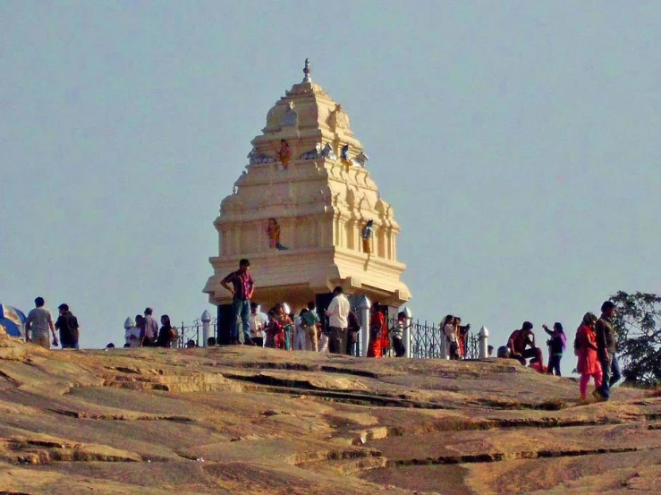 a group of people standing next to each other on a hill