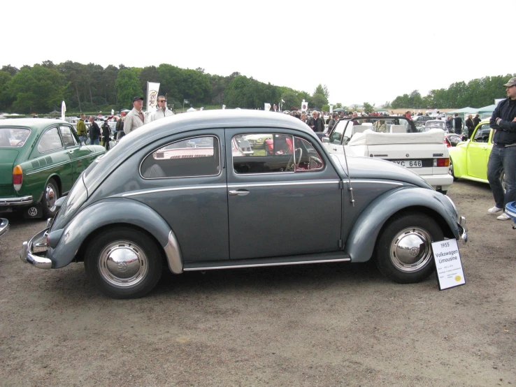 a vintage vw bug at an antique car show