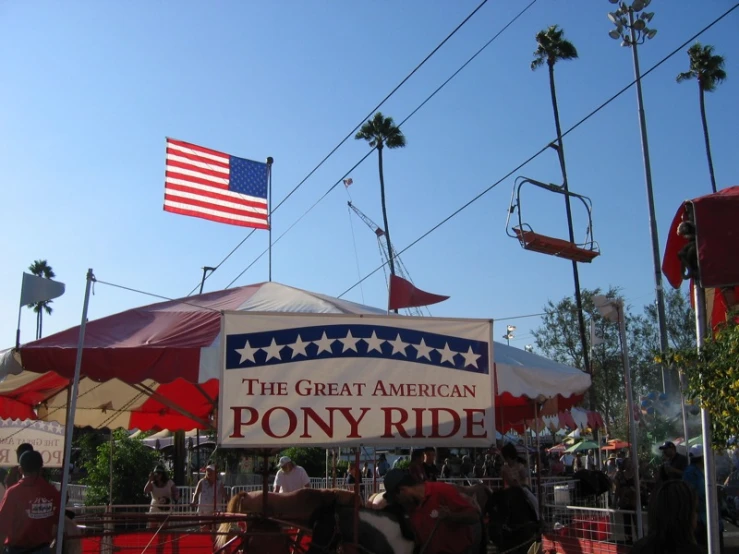 there are many horses in a parade with american flags on it