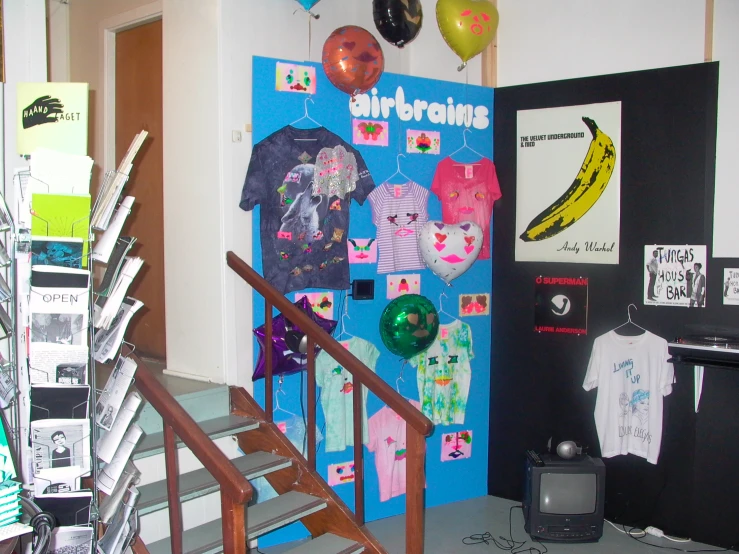 a door display with clothes on it and hanging decorations