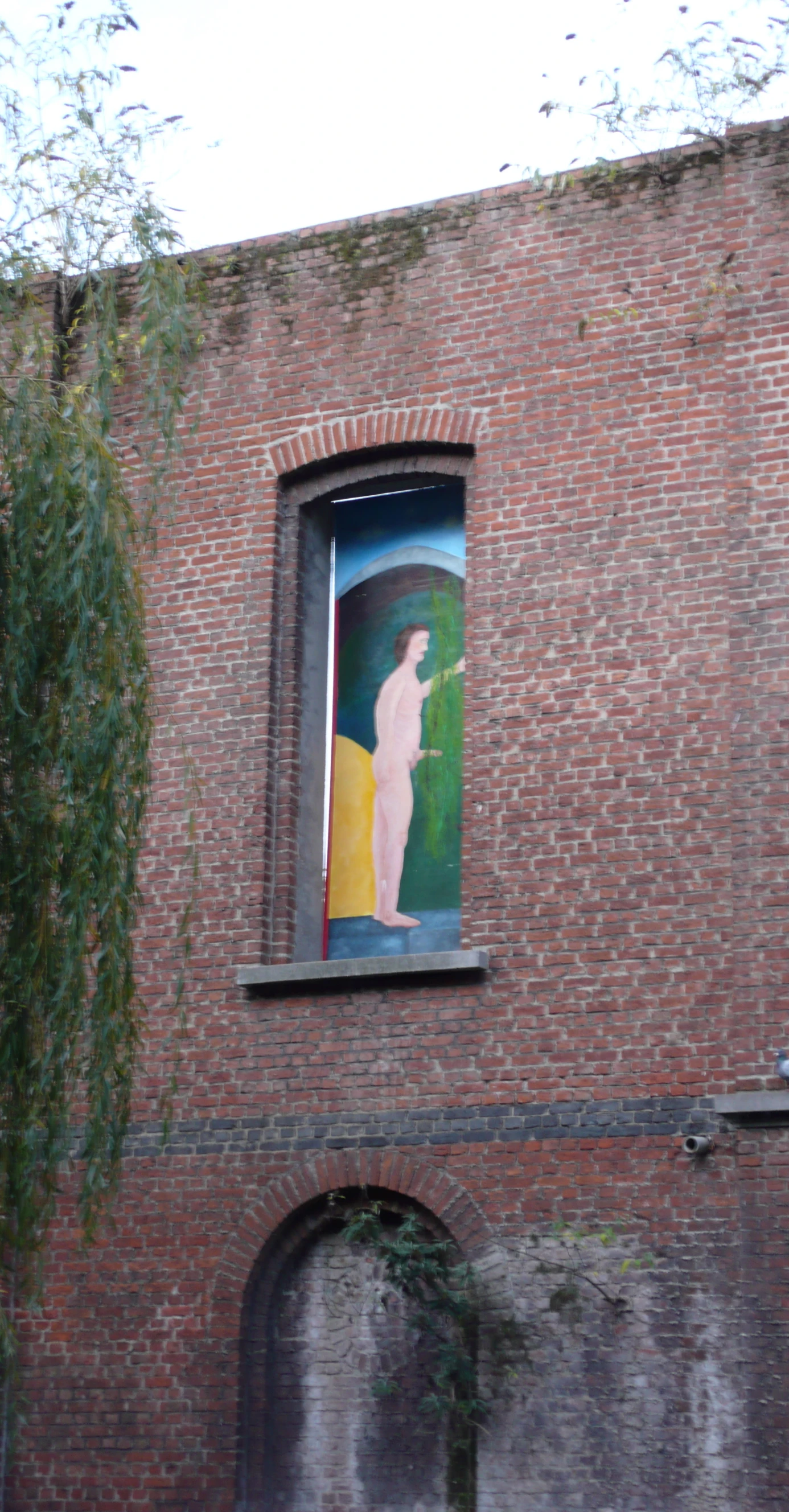 a mural of a woman looking out the window