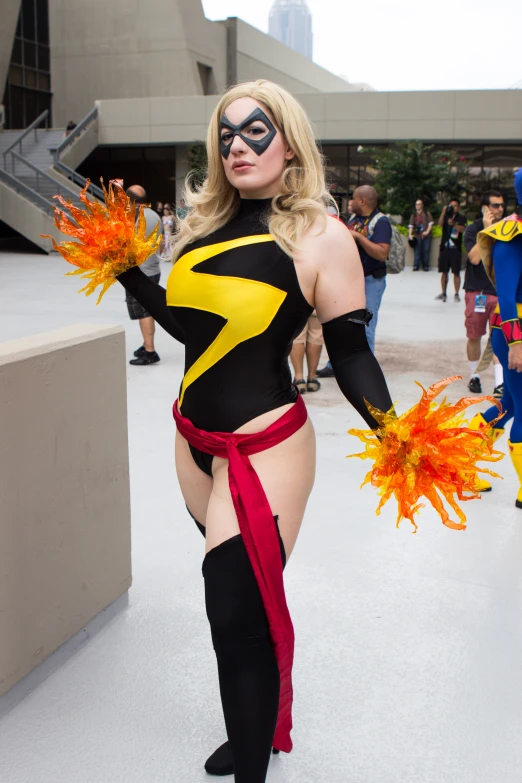 a women in a costume standing with two hands out