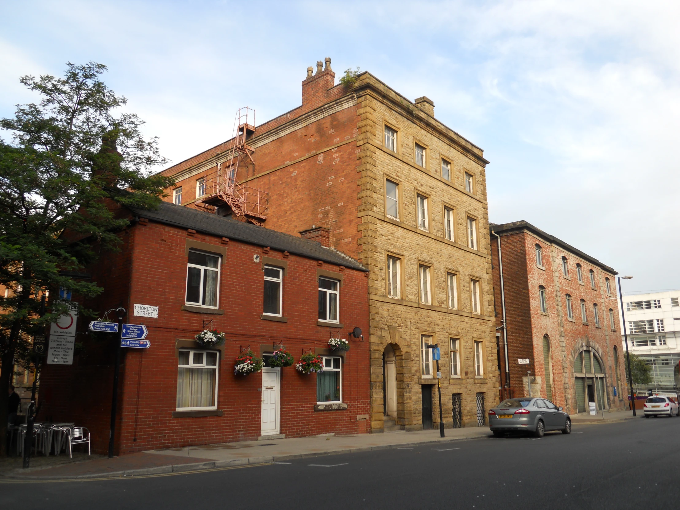 a big red brick building on a side walk