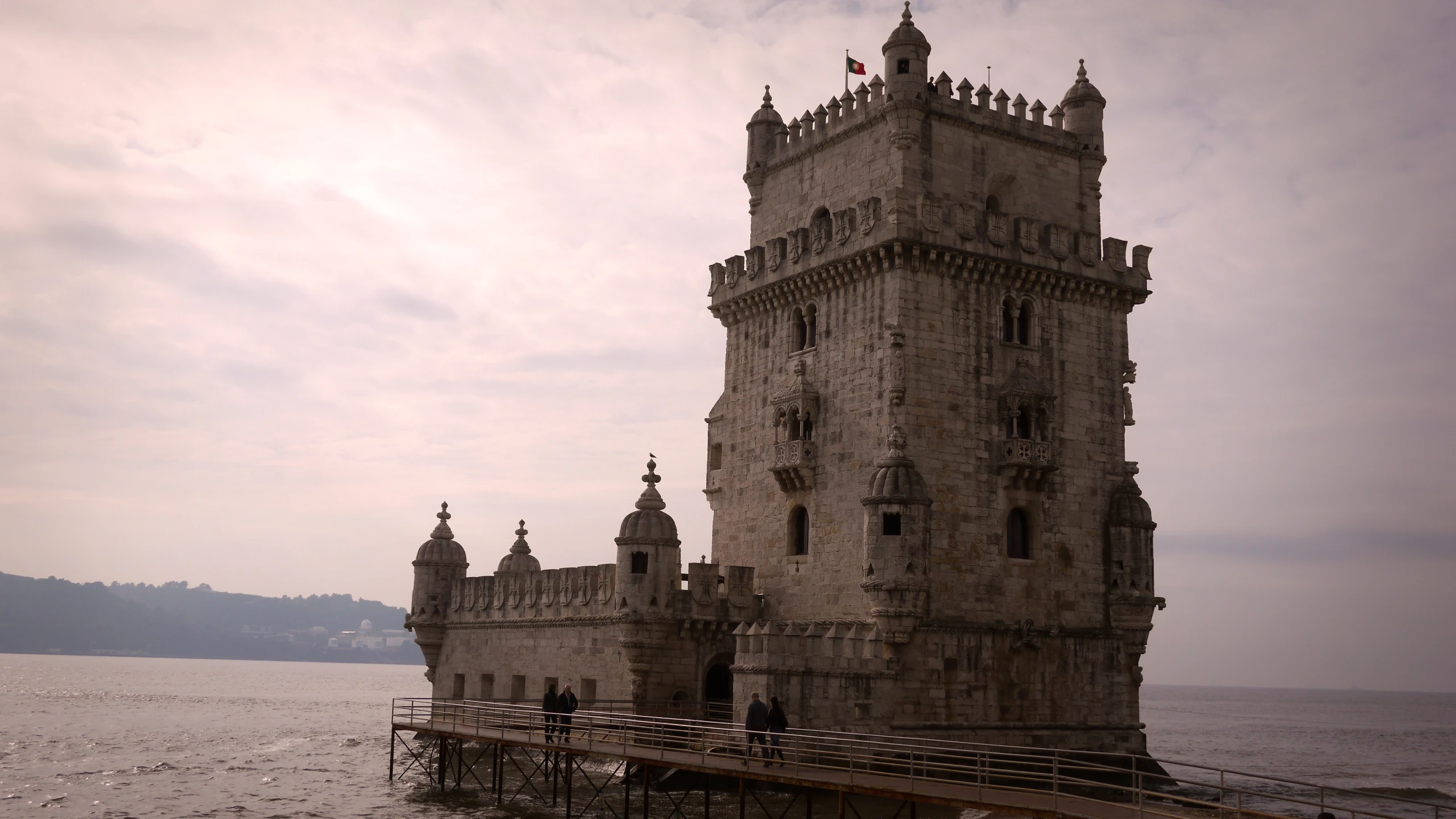 an old tower is sitting in the water